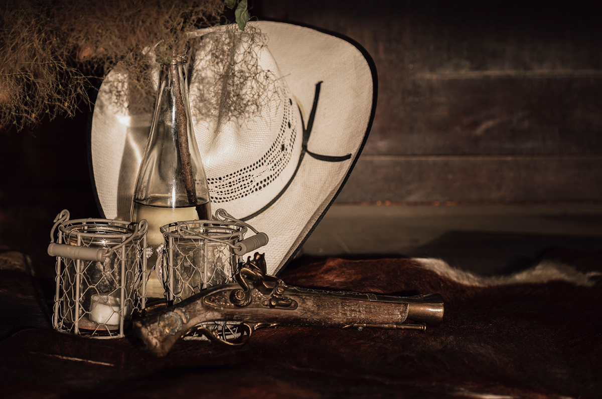 Western hat and candles as decoration in the saloon